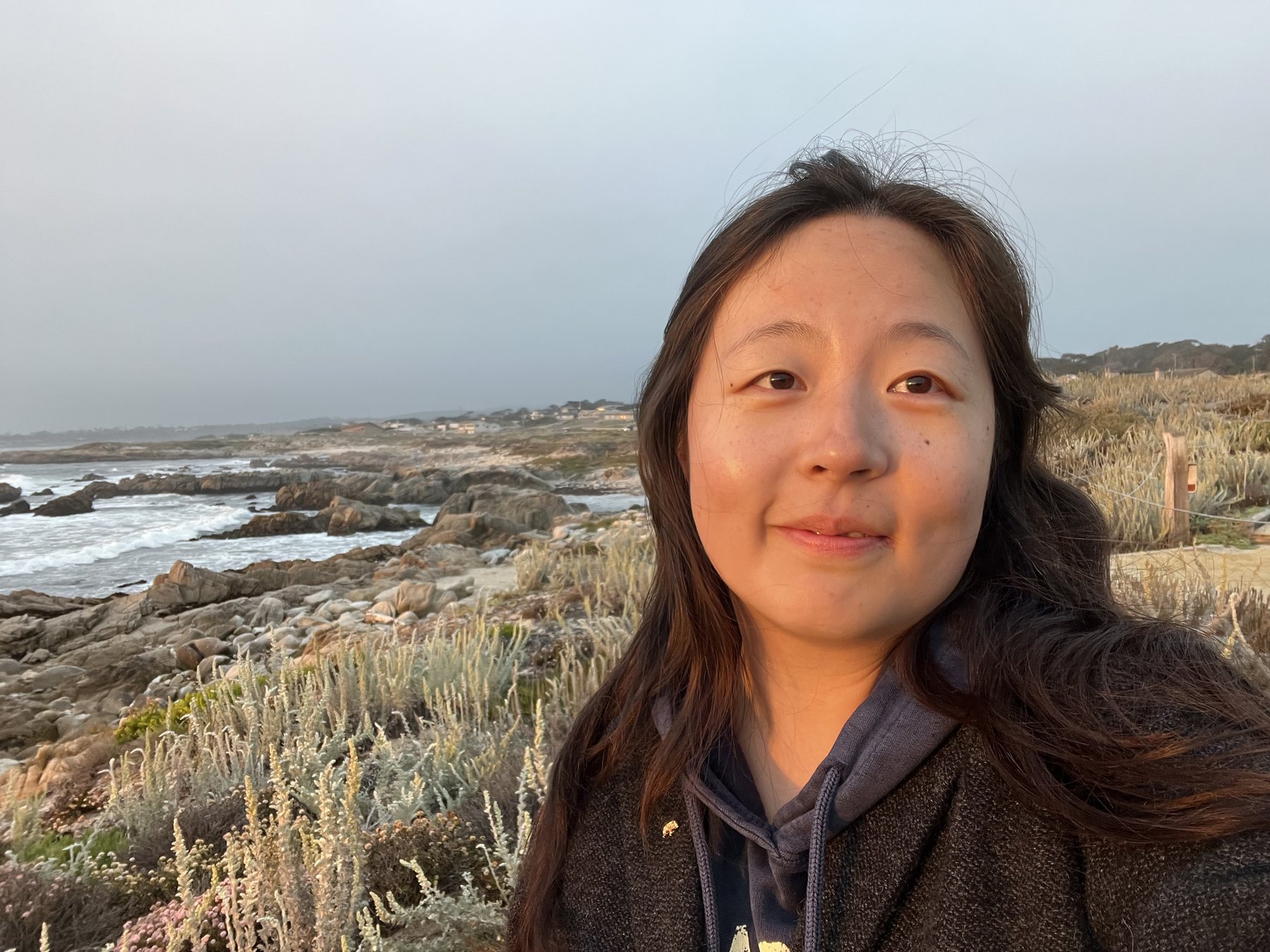 Chenxi Zi on a rocky coast in the evening light